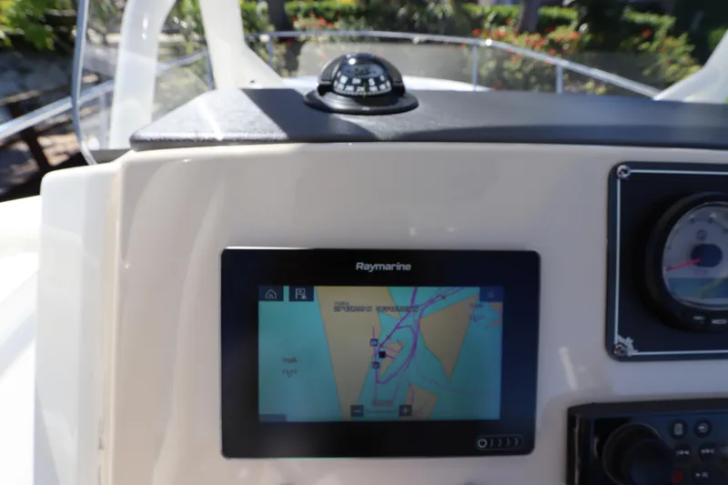 Slide: The Image of 2019 Boston Whaler 210 Montauk dashboard with Raymarine navigation display. - 17