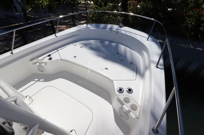 Slide: The Image of 2019 Boston Whaler 210 Montauk boat interior with seating and storage compartments. - 21