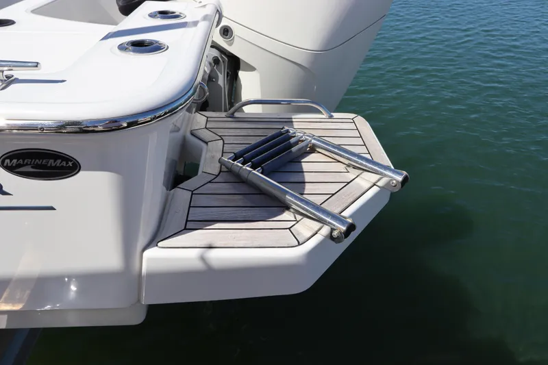 Slide: The Image of 2019 Boston Whaler 210 Montauk swim platform with ladder on calm water. - 5