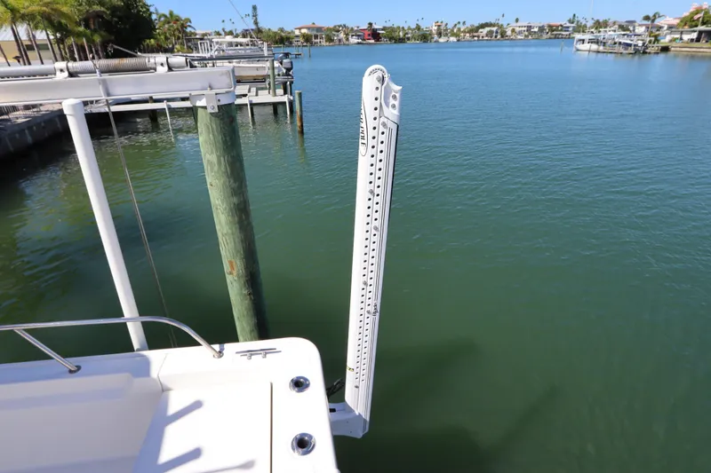 Slide: The Image of 2019 Boston Whaler 210 Montauk boat docked by calm waterfront. - 6