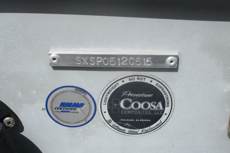 Slide: The Image of 2015 Sea Hunt Triton 225 boat identification plate with Coosa Composites and NMMA certification labels. - 14