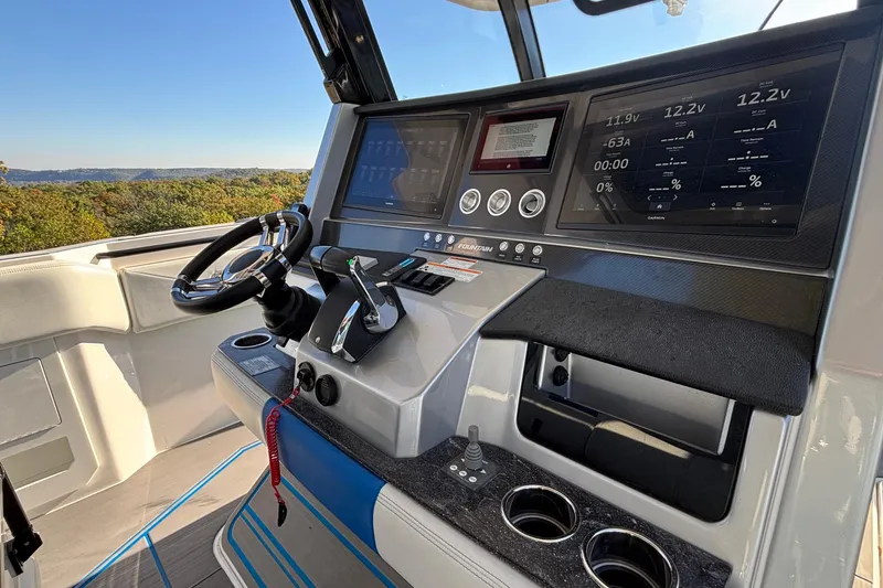 Slide: The Image of 2024 Fountain 38 SCX boat dashboard with advanced controls and digital displays. - 10