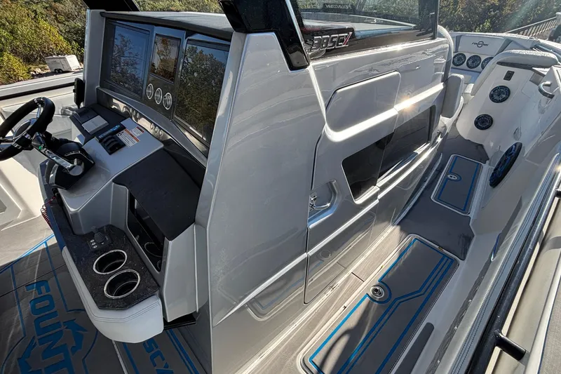 Slide: The Image of 2024 Fountain 38 SCX boat cockpit with modern controls and sleek design. - 11