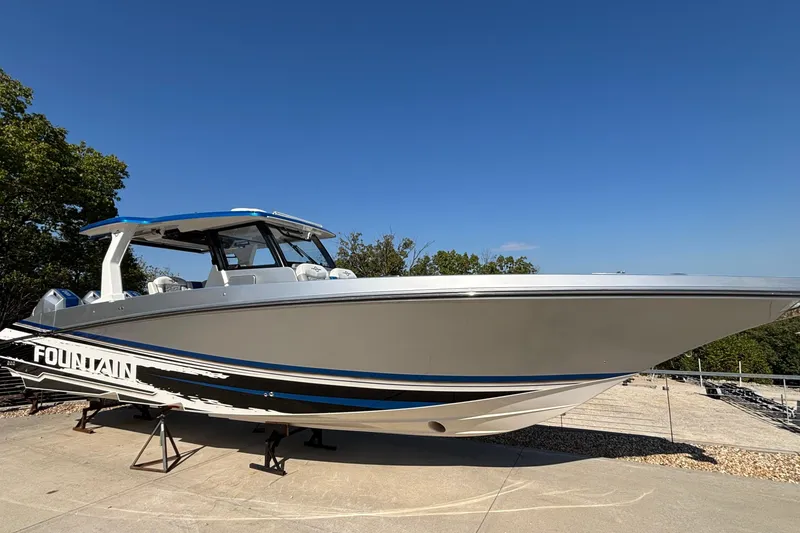 Slide: The Image of 2024 Fountain 38 SCX boat on display, sleek design under clear blue sky. - 2