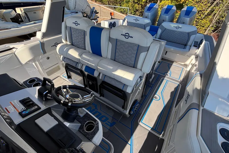 Slide: The Image of 2024 Fountain 38 SCX boat interior with luxurious seating and modern steering console. - 21