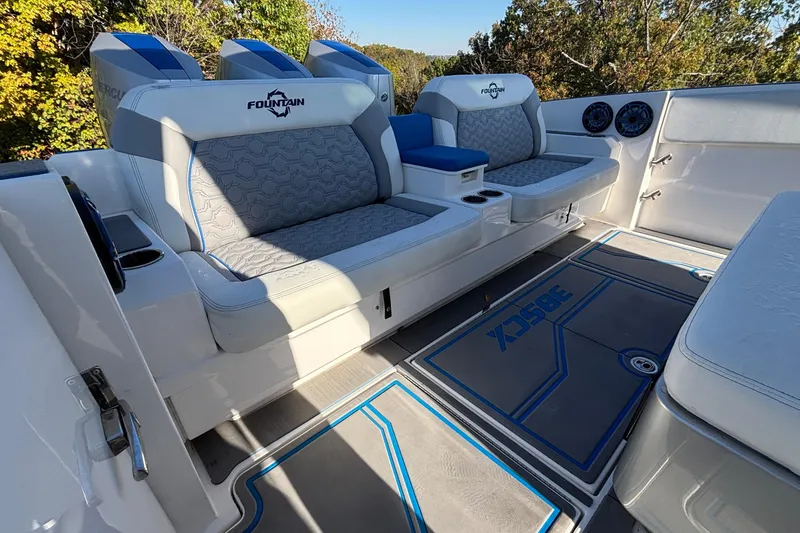 Slide: The Image of 2024 Fountain 38 SCX boat interior with cushioned seating and stylish flooring. - 25