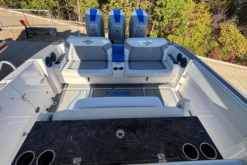 Slide: The Image of 2024 Fountain 38 SCX boat interior with seating and outboard motors. - 33