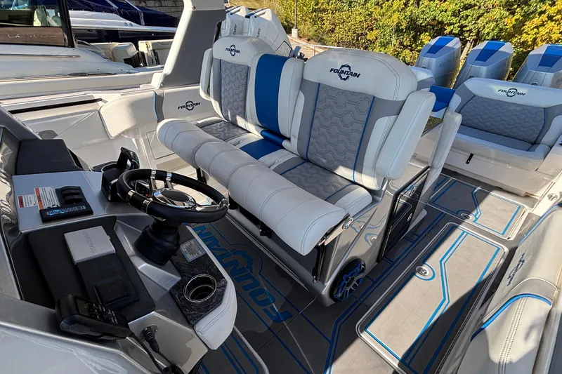 Slide: The Image of 2024 Fountain 38 SCX boat interior with luxury seating and modern steering console. - 34