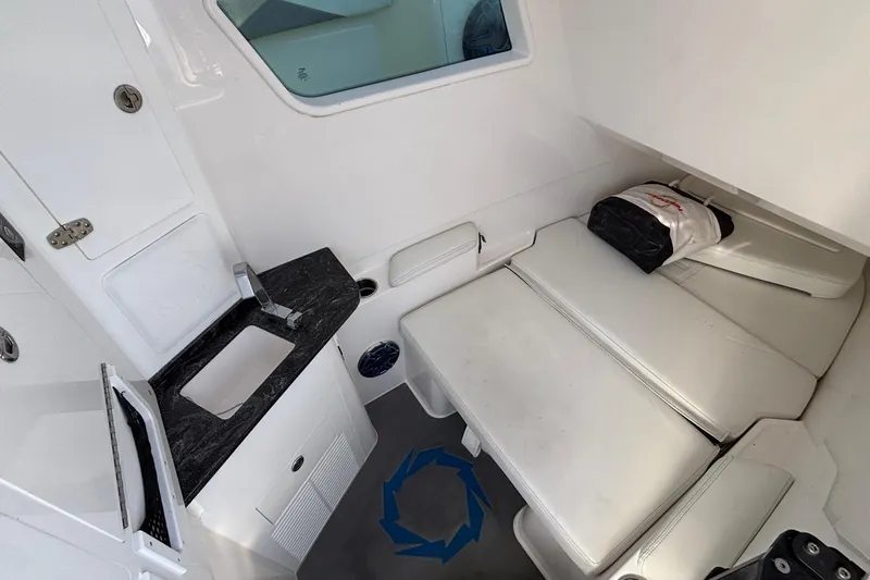 Slide: The Image of 2024 Fountain 38 SCX cabin interior with sink and cushioned seating. - 7