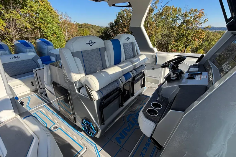 Slide: The Image of 2024 Fountain 38 SCX boat interior with luxurious seating and modern dashboard. - 8