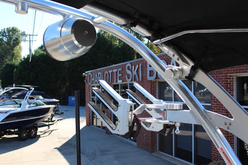 Slide: The Image of 2019 MasterCraft XT22 boat at Charlotte Ski Boats dealership, featuring sleek metal framework. - 13