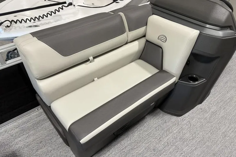 Slide: The Image of 2026 Sun Tracker Fishin' Barge 22 DLX livewell with cup holders and storage compartments. - 10