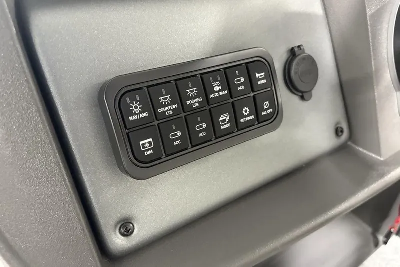 Slide: The Image of 2026 Sun Tracker Fishin' Barge 22 DLX interior with cup holder and seating. - 14