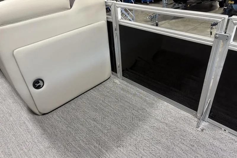 Slide: The Image of Open storage compartment on 2026 Sun Tracker Fishin' Barge 22 DLX boat. - 16