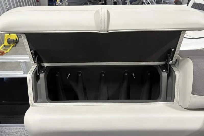 Slide: The Image of Storage compartment in 2026 Sun Tracker Fishin' Barge 22 DLX boat interior. - 17