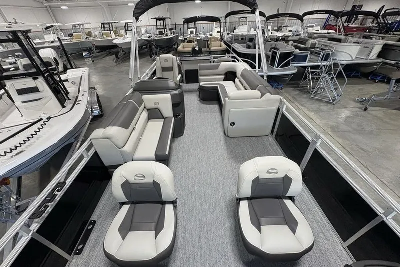 Slide: The Image of 2026 Sun Tracker Fishin' Barge 22 DLX fishing station with measuring board and cup holders. - 37