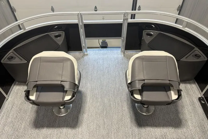 Slide: The Image of 2026 Sun Tracker Fishin' Barge 22 DLX interior storage compartments and seating. - 7