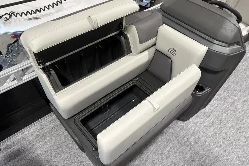 Slide: The Image of 2026 Sun Tracker Fishin' Barge 22 DLX fishing station with ruler and cup holders. - 8