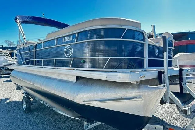 The Image of 2016 Godfrey Sweetwater 2286 Pontoon boat on trailer, blue and silver design. - 0