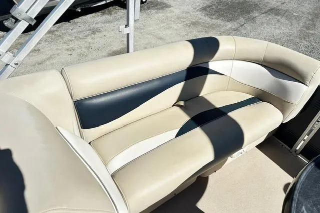 Slide: The Image of 2016 Godfrey Sweetwater 2286 Pontoon boat seating, beige and navy upholstery. - 10