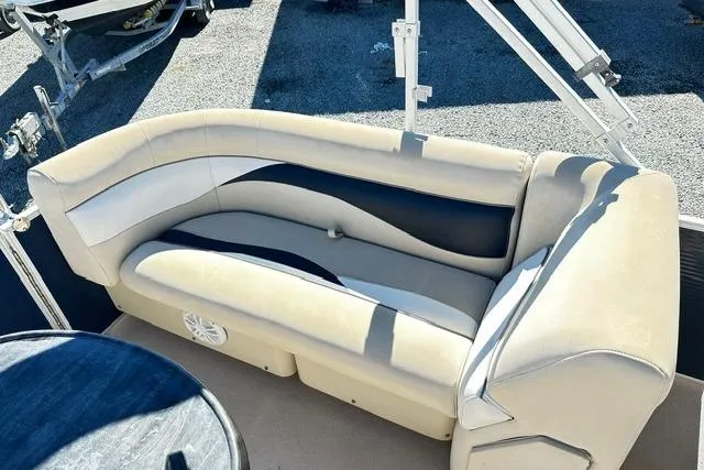 Slide: The Image of 2016 Godfrey Sweetwater 2286 Pontoon boat seating with beige and black upholstery. - 12