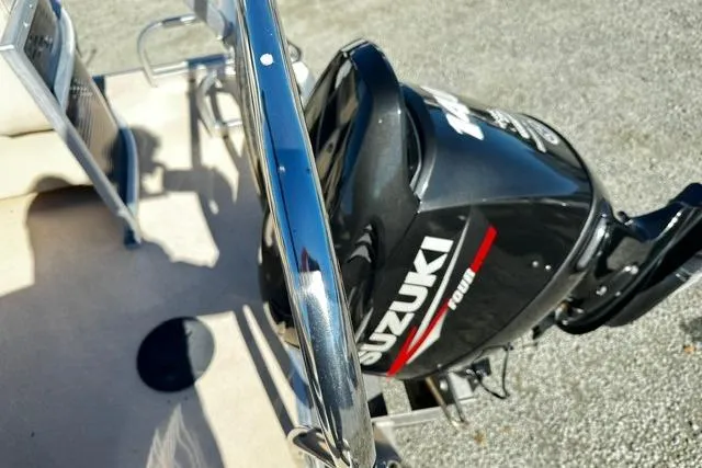 Slide: The Image of 2016 Godfrey Sweetwater 2286 Pontoon with Suzuki outboard motor, close-up view. - 17