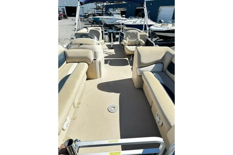 Slide: The Image of 2016 Godfrey Sweetwater 2286 Pontoon with beige seating and spacious deck. - 9
