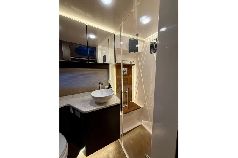 Slide: The Image of Luxurious bathroom in 2018 Regal 42 Grande Coupe yacht with modern fixtures and elegant design. - 15