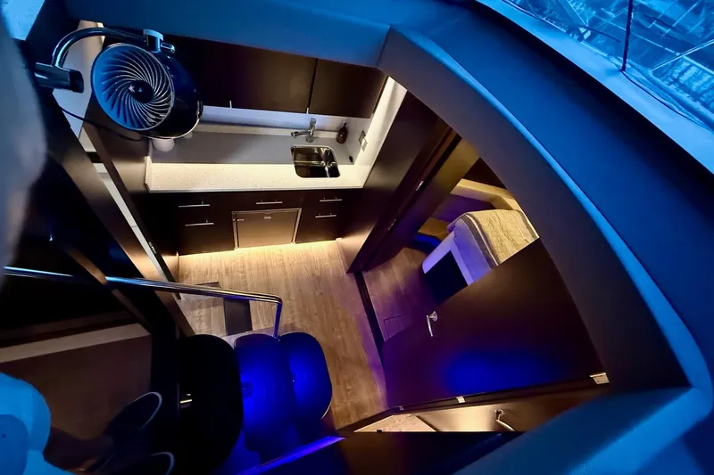 Slide: The Image of Luxurious seating area on a 2018 Regal 42 Grande Coupe yacht at a marina. - 5