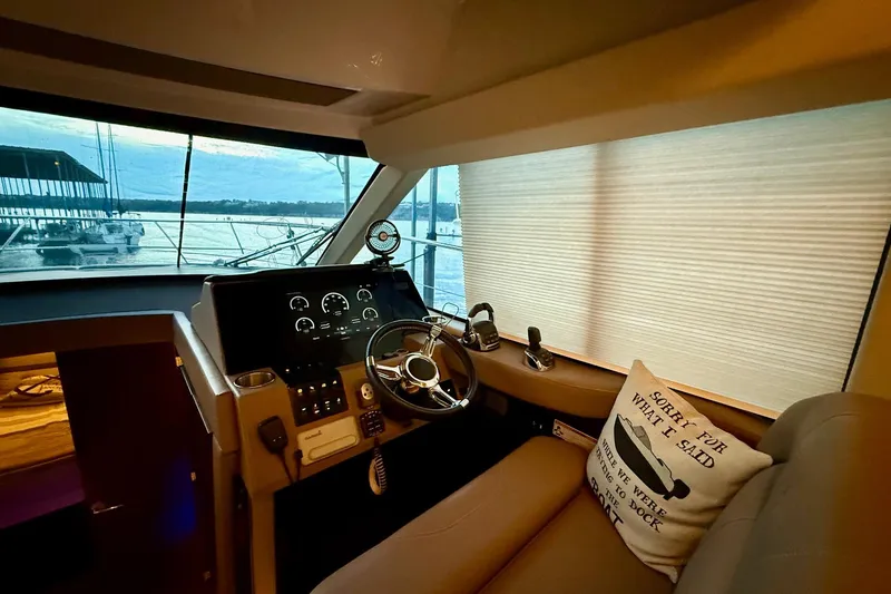 Slide: The Image of Luxurious interior of 2018 Regal 42 Grande Coupe yacht with modern kitchen and cozy bedroom. - 6