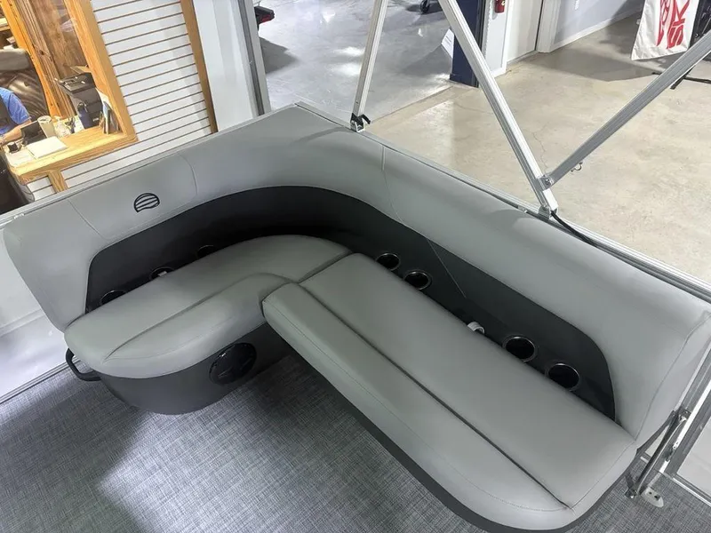 Slide: The Image of 2026 Sun Tracker PARTY BARGE® 16 DLX interior seating with cup holders and modern design. - 10