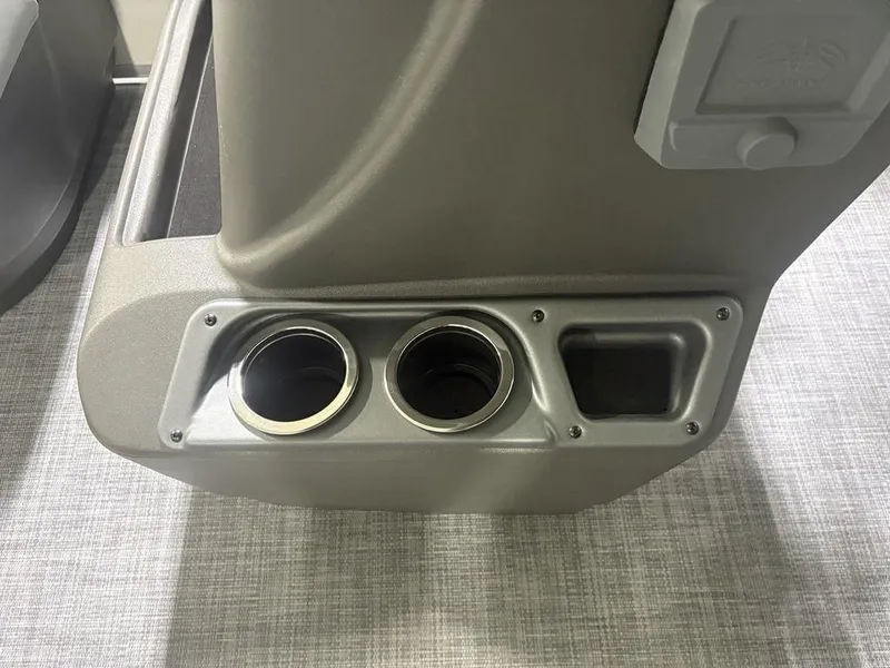 Slide: The Image of Cup holders and storage on 2026 Sun Tracker PARTY BARGE® 16 DLX boat interior. - 11