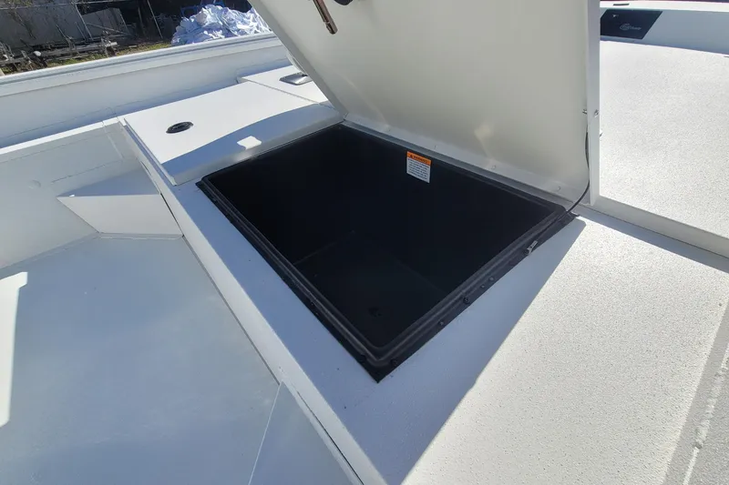 Slide: The Image of Open storage compartment on 2026 G3 Bay 20 boat deck. - 10
