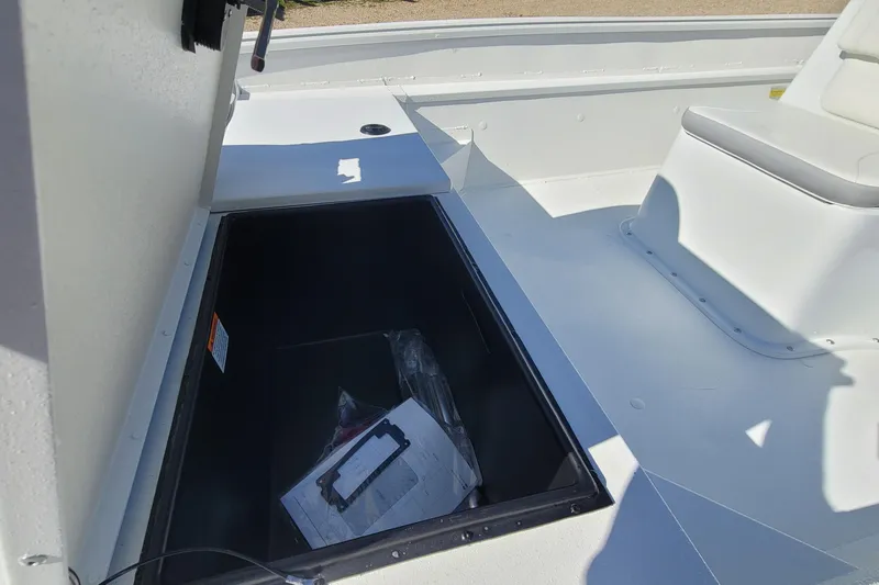 Slide: The Image of Open storage compartment in 2026 G3 Bay 20 boat, showcasing interior space and seating. - 11