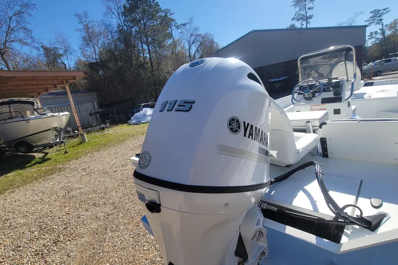 Slide: The Image of 2026 G3 Bay 20 boat with Yamaha 115 outboard motor in a sunny outdoor setting. - 12