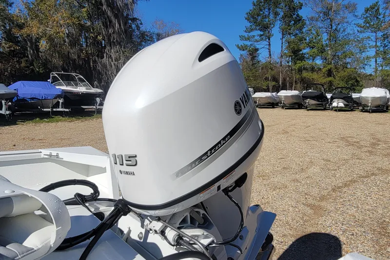 Slide: The Image of 2026 G3 Bay 20 boat with Yamaha 115 outboard motor in a boatyard. - 13