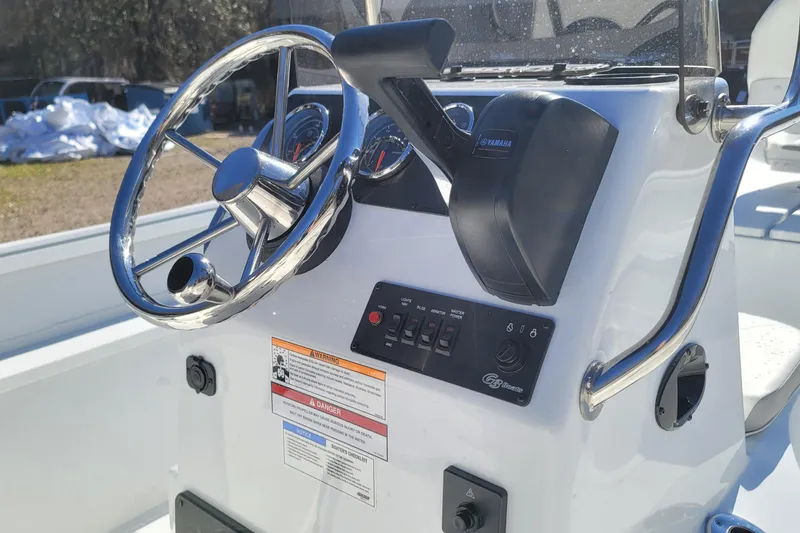 Slide: The Image of 2026 G3 Bay 20 boat console with steering wheel and Yamaha controls. - 15