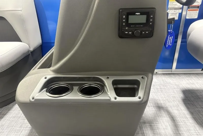 Slide: The Image of 2026 Sun Tracker Party Barge 16 DLX console with cup holders and control panel. - 10