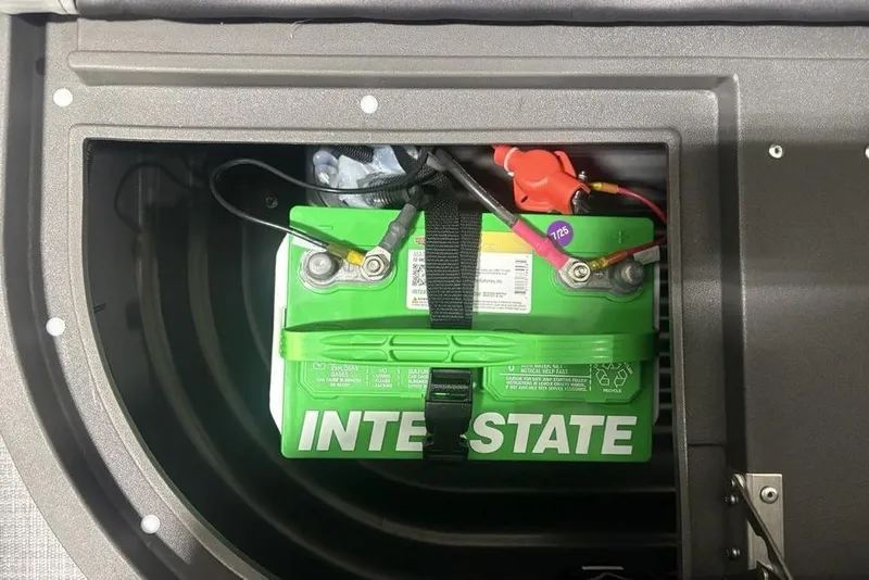 Slide: The Image of Battery compartment of 2026 Sun Tracker Party Barge 16 DLX with Interstate battery. - 21
