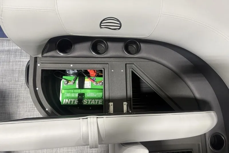 Slide: The Image of 2026 Sun Tracker Party Barge 16 DLX battery compartment with Interstate battery visible. - 23