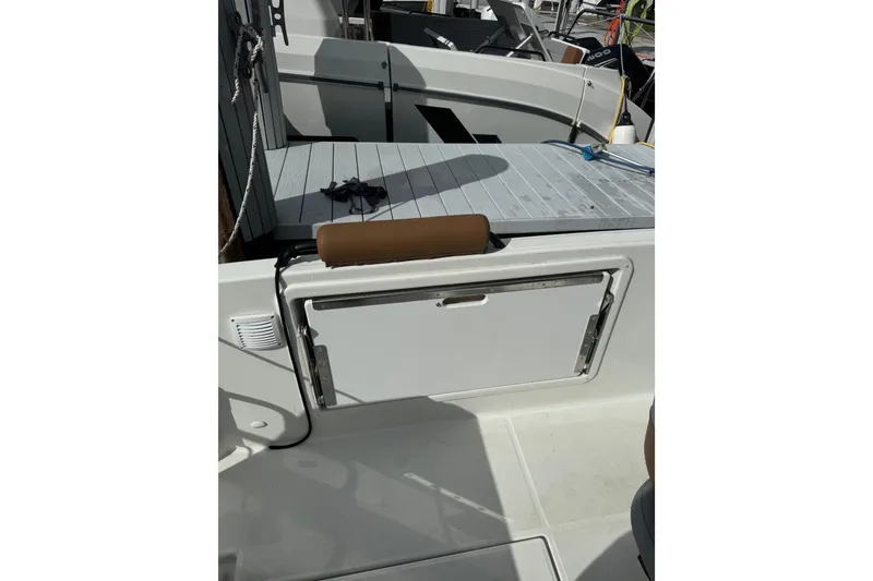 Slide: The Image of 2024 Beneteau Flyer 7 SPACEdeck boat interior with seating and storage compartment. - 12