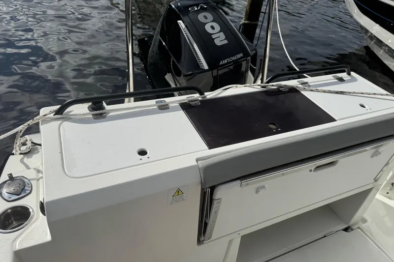 Slide: The Image of 2024 Beneteau Flyer 7 SPACEdeck with Mercury outboard engine, docked on water. - 19