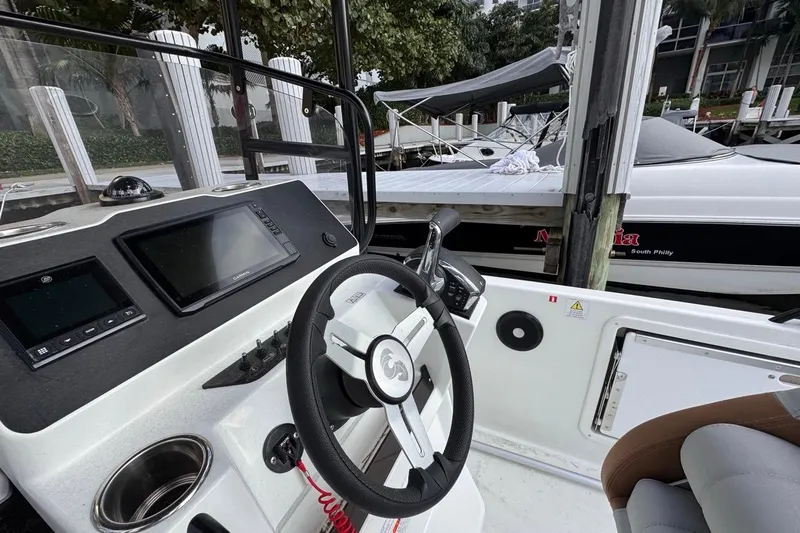Slide: The Image of 2024 Beneteau Flyer 7 SPACEdeck helm with modern controls and navigation display. - 26
