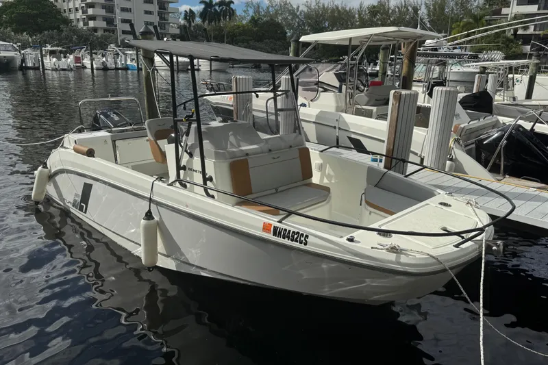 Slide: The Image of 2024 Beneteau Flyer 7 SPACEdeck boat docked in a marina, showcasing sleek design and modern features. - 3