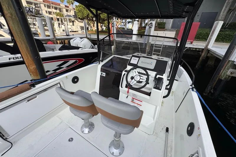 Slide: The Image of 2024 Beneteau Flyer 7 SPACEdeck boat interior with steering console and seating. - 34