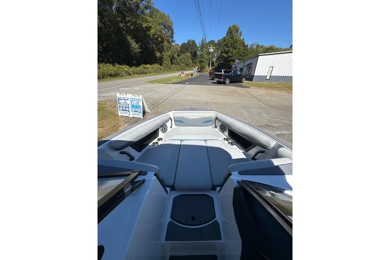 Slide: The Image of Interior of 2023 Axis T220 boat with blue and gray seating. - 12