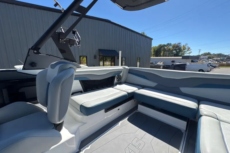 Slide: The Image of 2023 Axis T220 boat interior with gray seating and cup holders. - 14