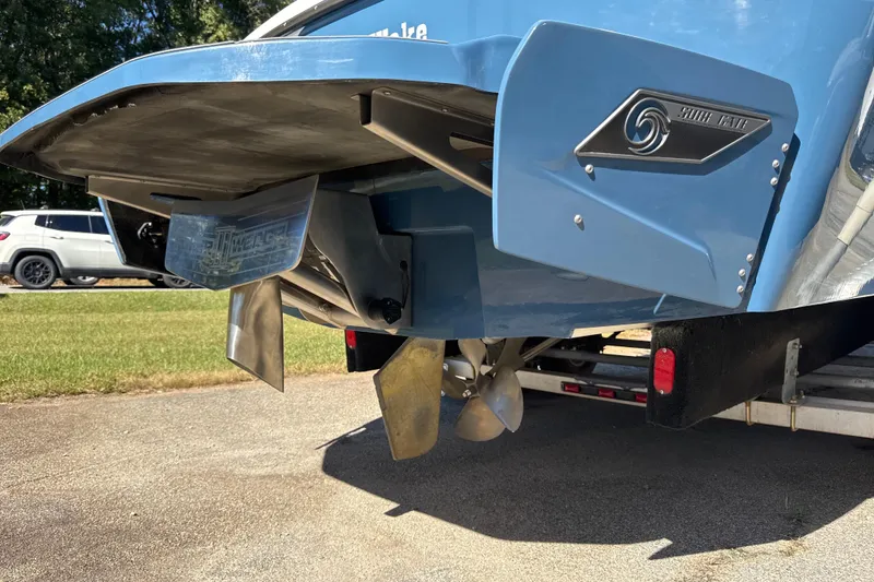 Slide: The Image of Rear view of 2023 Axis T220 boat with Surf Gate and propeller system. - 27