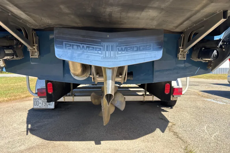 Slide: The Image of Rear view of a 2023 Axis T220 boat with propeller and wake system. - 28