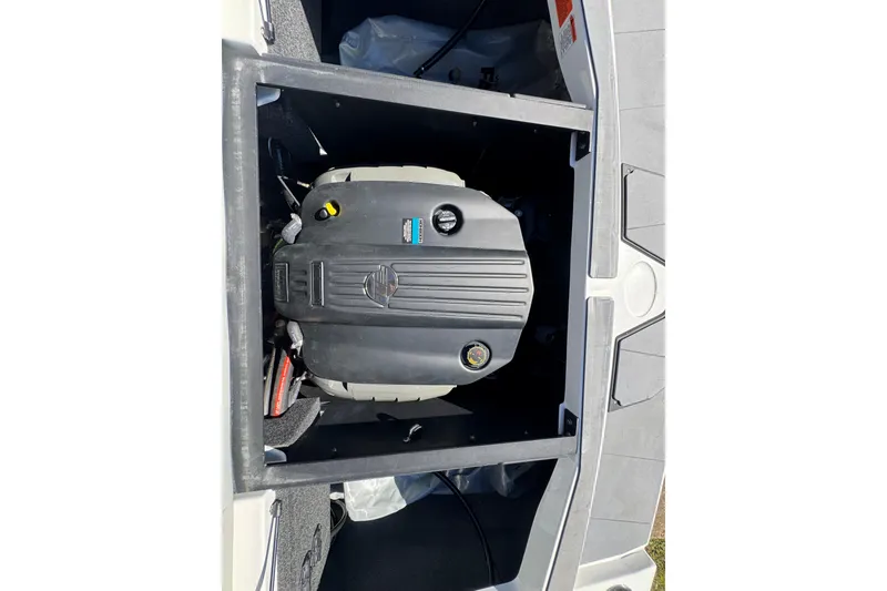 Slide: The Image of Open storage compartment of 2023 Axis T220 boat, showing interior details. - 32